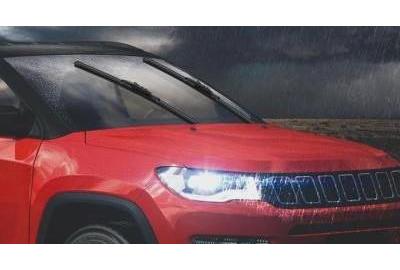 A vehicle using its wiper blades in rainy weather